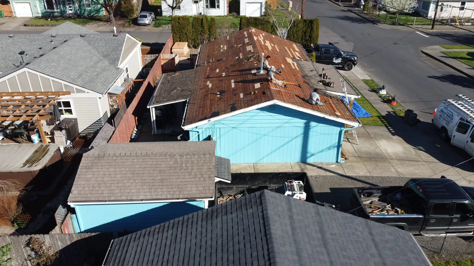 Drone aerial of the Battle Ground, WA roof replacement - open-lot home with new architectural shingles, view 1