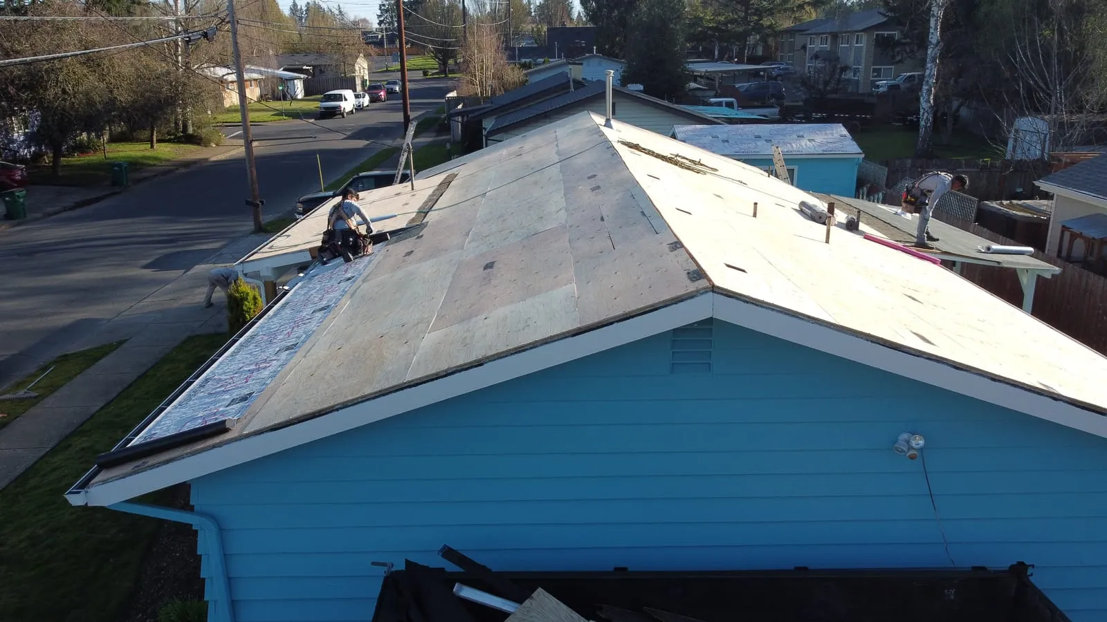 Drone aerial of the Battle Ground, WA roof replacement - wind-exposed ridge with new ridge cap, view 2