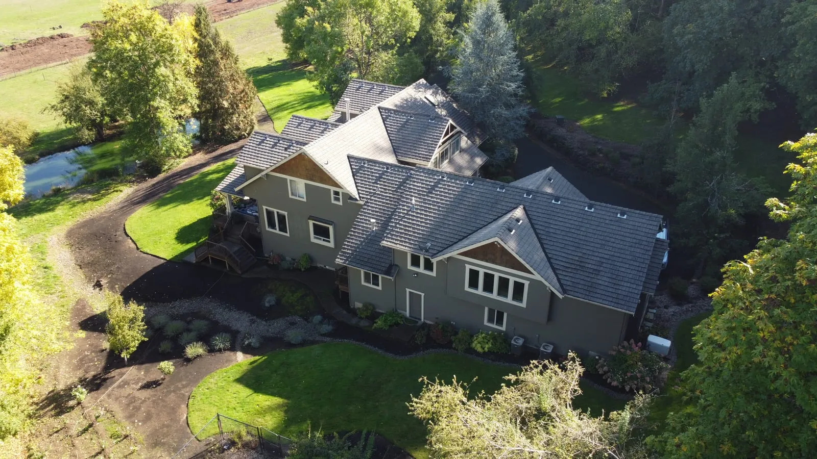 Drone aerial of the Battle Ground, WA roof replacement - angle on the finished project, view 8