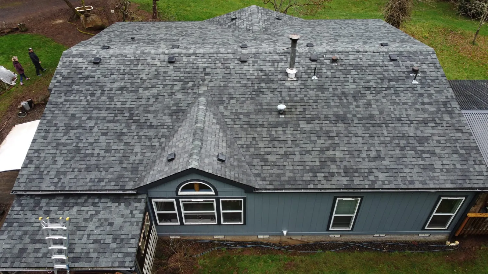 Drone aerial of the Camas, WA roof replacement - front of home with new shingles, view 13