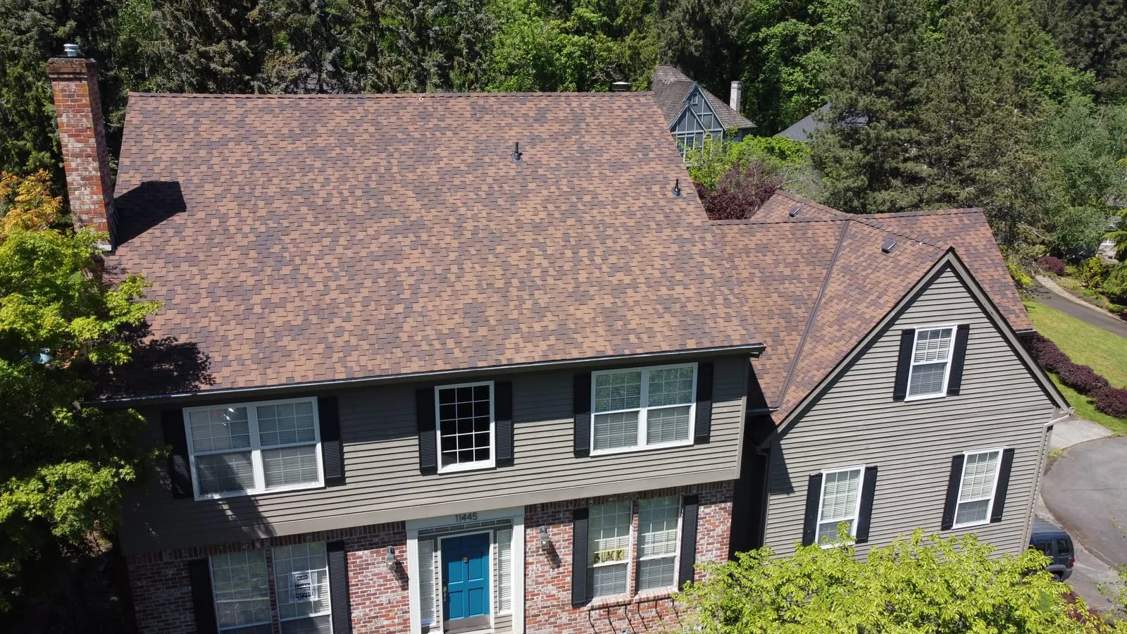 Drone aerial of the Vancouver, WA full-exterior remodel - angled view of the home and new TimberTech deck, view 4