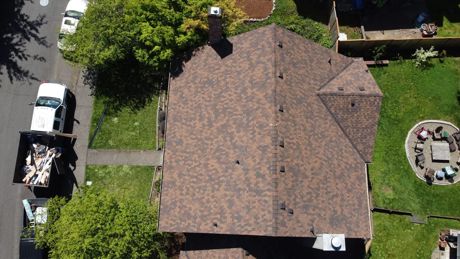 Drone aerial of the Vancouver, WA full-exterior remodel - rear elevation with TimberTech deck visible, view 7