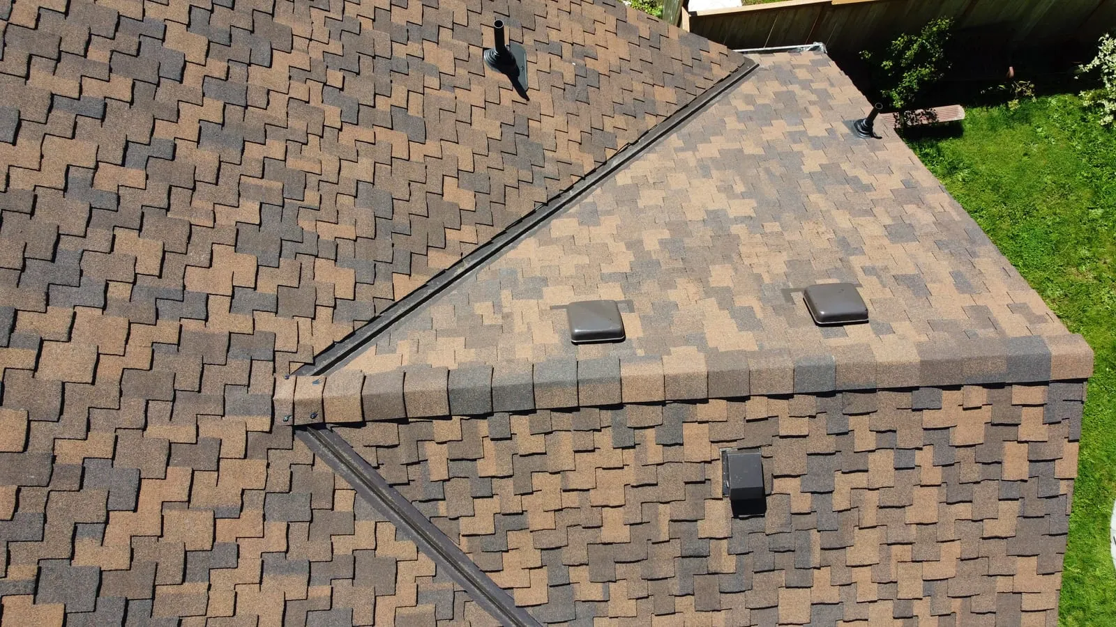 Drone aerial of the Vancouver, WA full-exterior remodel - overhead of the new roof system, view 9