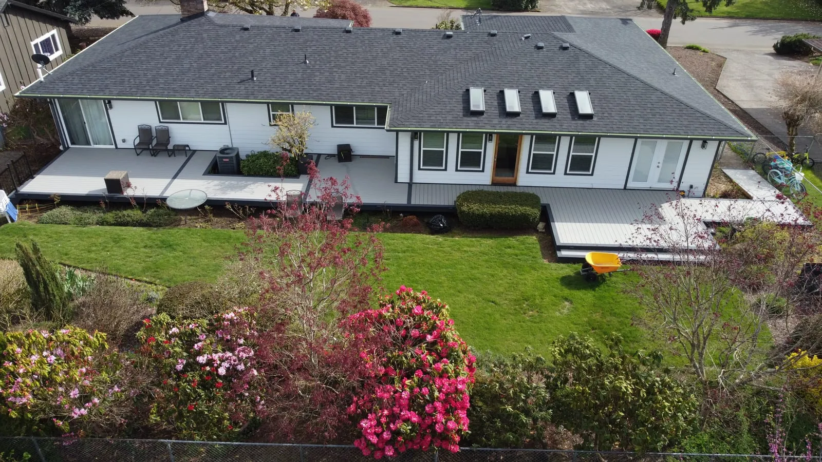 Full exterior remodel in Vancouver, WA - new architectural roof, 6K seamless gutters, James Hardie siding, and TimberTech composite deck