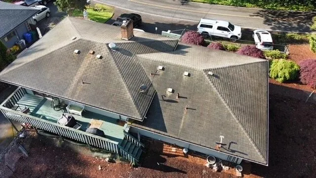 Quality Master Roofing & Remodel truck on a Vancouver, WA job site